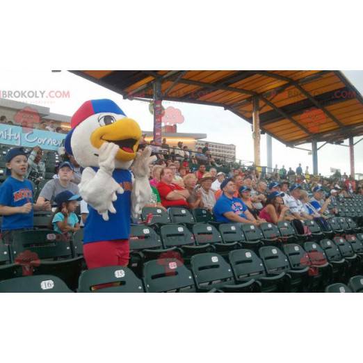 Mascotte d'oiseau de mouette en tenue bleue et rouge -