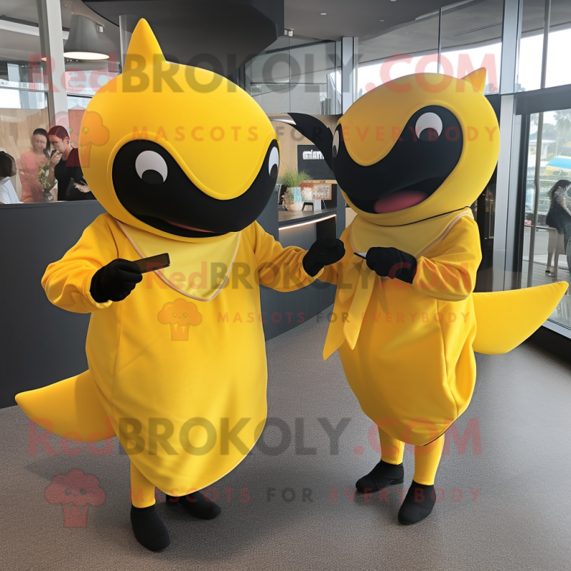 Yellow Killer Whale mascot costume character dressed with a Shift Dress and Cummerbunds