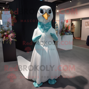 Teal Dove mascot costume character dressed with a Wedding Dress and Lapel pins