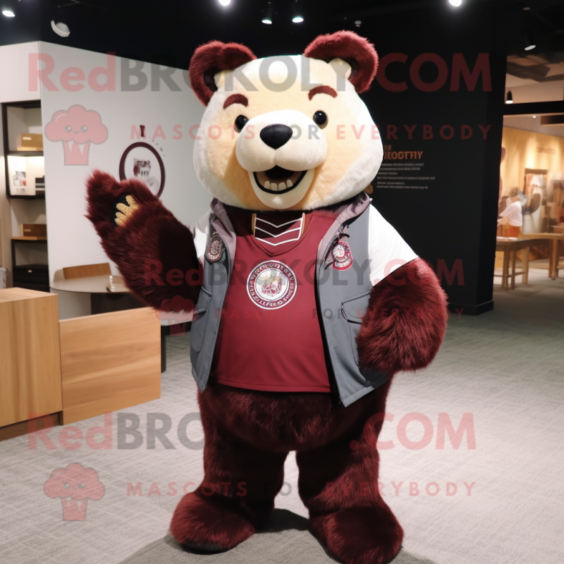 Maroon Bear mascot costume character dressed with a Vest and Keychains