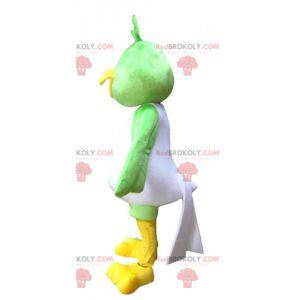 Mascot gran pájaro verde, blanco y amarillo muy sonriente -