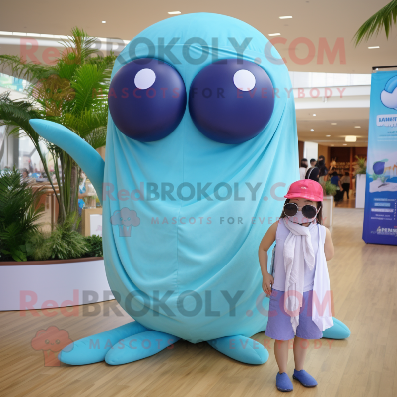 Tan Blue Whale mascot costume character dressed with a Bikini and Wraps Tan Blue Whale mascot costume character dressed with a Bikini and Wraps