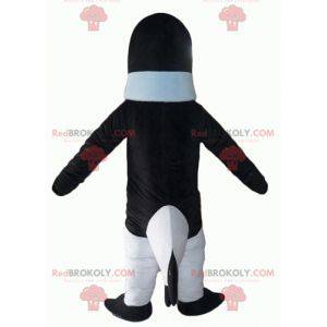 Zwart-witte pinguïn mascotte met een blauwe trui -