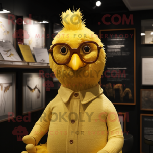 Gold Chicken mascot costume character dressed with a Sweater and Eyeglasses