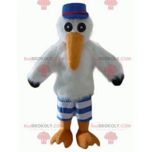 Mascotte de mouette de cigogne avec une casquette et un maillot