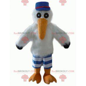 Mascotte de mouette de cigogne avec une casquette et un maillot