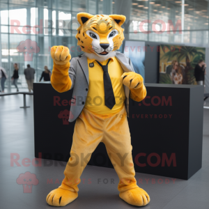 Yellow Bobcat mascot costume character dressed with a Blazer and Gloves