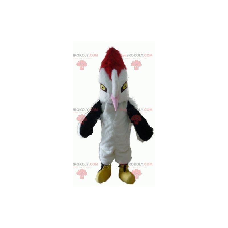 Mascotte de bel oiseau blanc noir et rouge avec un grand bec -