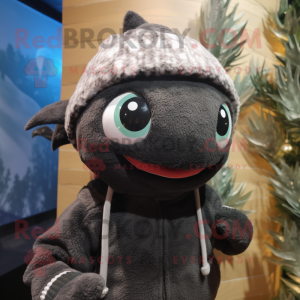 Black Tuna mascot costume character dressed with a Sweater and Beanies