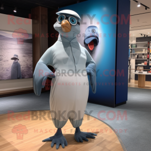 Silver Pigeon mascot costume character dressed with a One-Piece Swimsuit and Caps