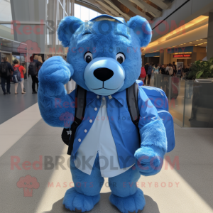 Blue Bear mascot costume character dressed with a Oxford Shirt and Backpacks