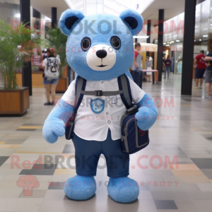 Blue Bear mascot costume character dressed with a Oxford Shirt and Backpacks