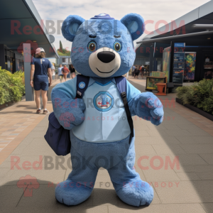 Blue Bear mascot costume character dressed with a Oxford Shirt and Backpacks