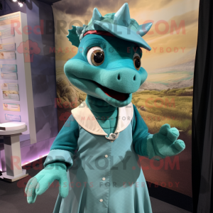 Teal Dragon mascot costume character dressed with a Skirt and Berets