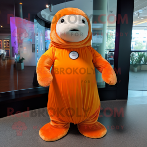 Orange Stellar'S Sea Cow mascot costume character dressed with a Pleated Skirt and Smartwatches