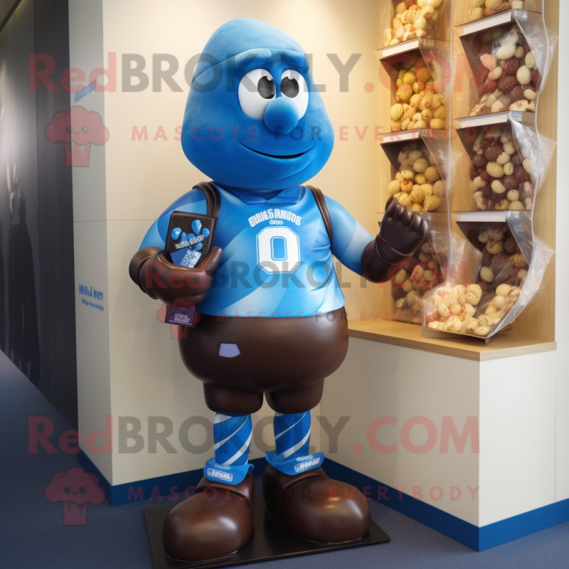 Blue Chocolates mascot costume character dressed with a Rugby Shirt and Shoe clips Blue Chocolates mascot costume character dressed with a Rugby Shirt and Shoe clips