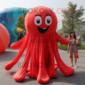 Red Jellyfish mascot costume character dressed with a Maxi Dress and Suspenders