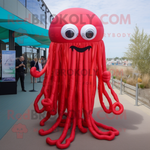 Red Jellyfish mascot costume character dressed with a Maxi Dress and Suspenders