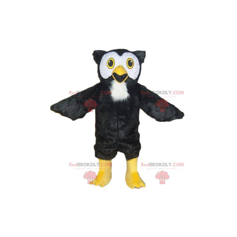 Mascotte de hibou noir blanc et jaune tout poilu -