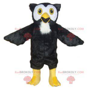 Mascotte de hibou noir blanc et jaune tout poilu -