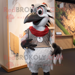 Silver Woodpecker mascot costume character dressed with a Rugby Shirt and Wraps