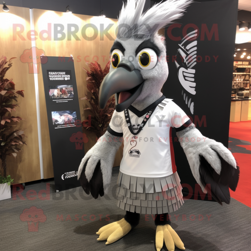 Silver Woodpecker mascot costume character dressed with a Rugby Shirt and Wraps