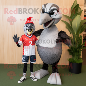 Silver Woodpecker mascot costume character dressed with a Rugby Shirt and Wraps