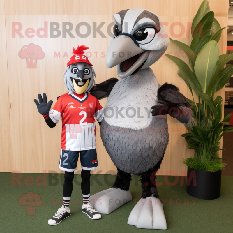 Silver Woodpecker mascot costume character dressed with a Rugby Shirt and Wraps Silver Woodpecker mascot costume character dressed with a Rugby Shirt and Wraps