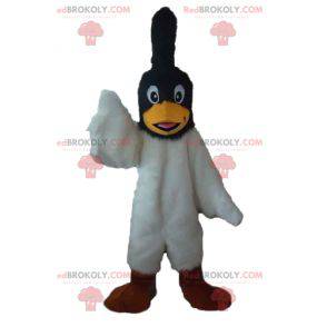 Zwart-witte vogel mascotte met een kuif op het hoofd -
