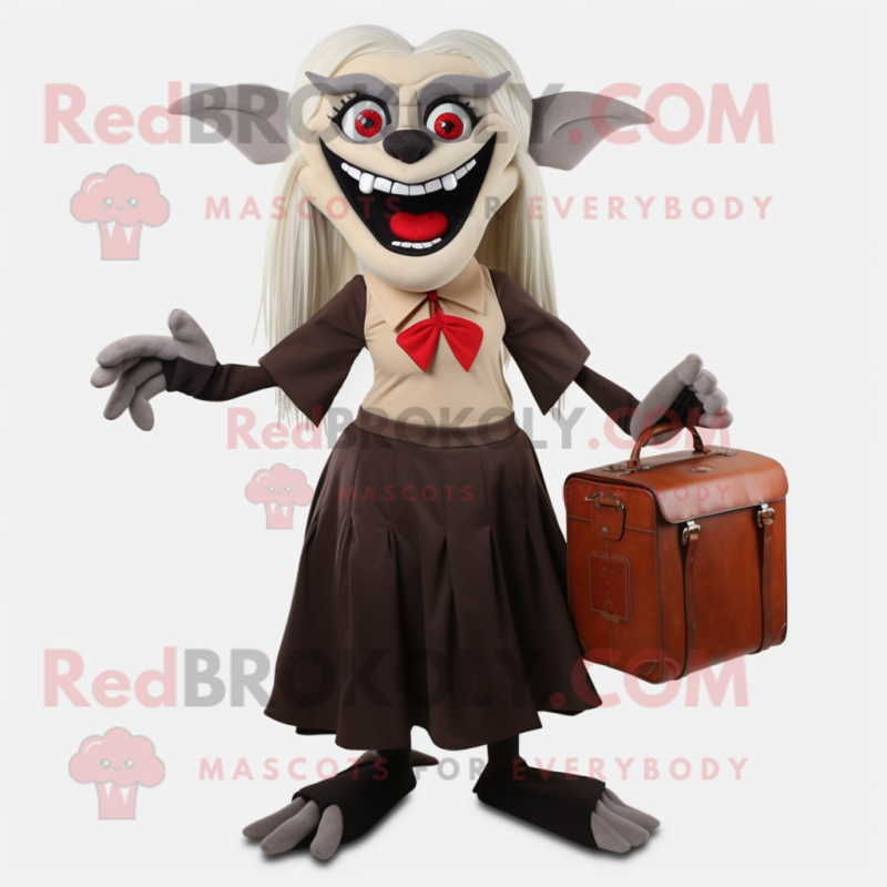 Tan Vampire mascot costume character dressed with a Pleated Skirt and Briefcases Tan Vampire mascot costume character dressed with a Pleated Skirt and Briefcases