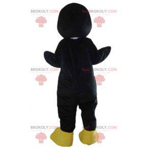Mascota de pingüino negro pájaro blanco y amarillo -