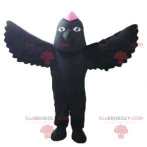 Mascotte zwarte vogel met een roze kuif op het hoofd -
