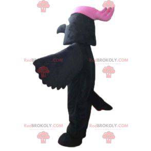 Mascote pássaro preto com uma crista rosa na cabeça -