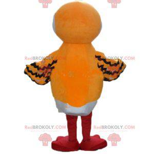 Mascot oranje witte en zwarte vogel met een lange snavel -
