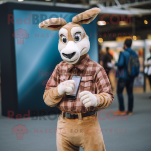 Beige Gazelle mascot costume character dressed with a Flannel Shirt and Smartwatches