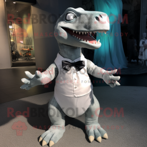 Silver Iguanodon mascot costume character dressed with a Mini Dress and Bow ties