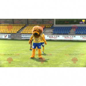 Mascotte de lion orange et marron en tenue de sport -