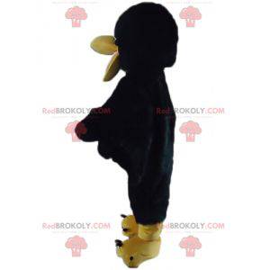 Mascota de cuervo negro y amarillo gigante y dulce -