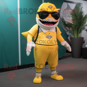 Yellow Megalodon mascot costume character dressed with a Bermuda Shorts and Eyeglasses