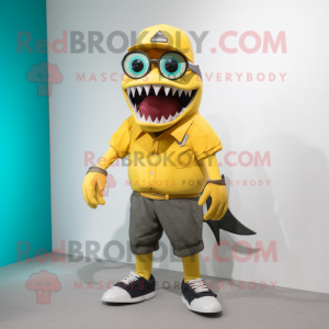 Yellow Megalodon mascot costume character dressed with a Bermuda Shorts and Eyeglasses