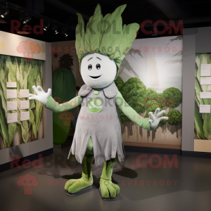 Silver Celery mascot costume character dressed with a Graphic Tee and Brooches