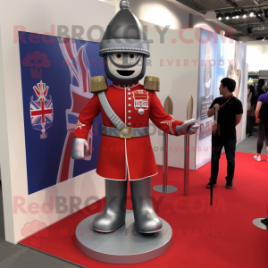 Silver British Royal Guard mascot costume character dressed with a Graphic Tee and Shoe clips