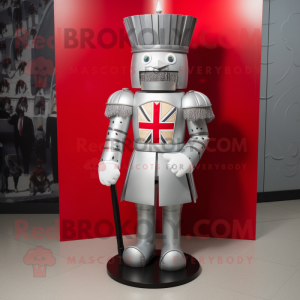 Silver British Royal Guard mascot costume character dressed with a Graphic Tee and Shoe clips