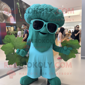 Teal Broccoli mascot costume character dressed with a Culottes and Sunglasses