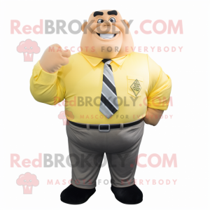 Yellow Strongman mascot costume character dressed with a Blouse and Tie pins