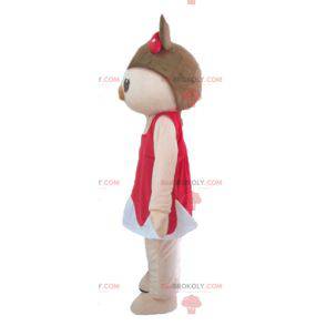 Mascotte de cochon rose et marron en robe rouge et blanche -