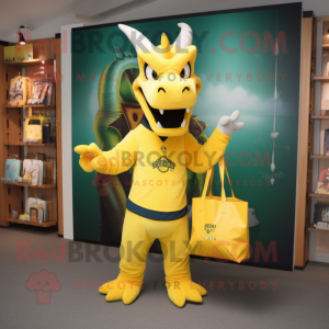 Yellow Dragon mascot costume character dressed with a Henley Tee and Tote bags