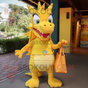 Yellow Dragon mascot costume character dressed with a Henley Tee and Tote bags