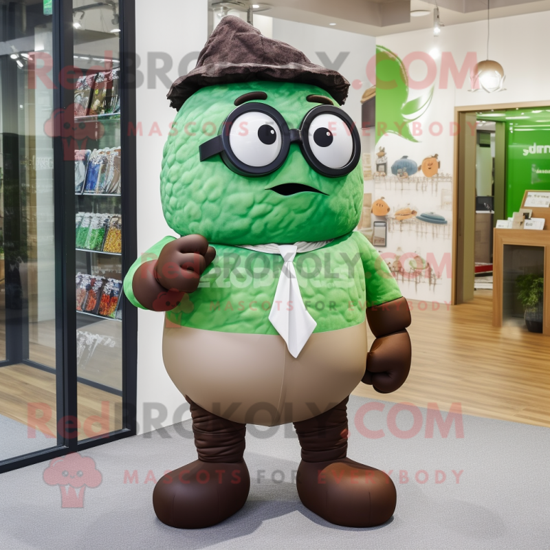 Green Chocolates mascot costume character dressed with a Dress Pants and Eyeglasses Green Chocolates mascot costume character dressed with a Dress Pants and Eyeglasses