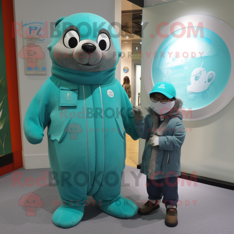 Turquoise Seal mascot costume character dressed with a Parka and Watches Turquoise Seal mascot costume character dressed with a Parka and Watches